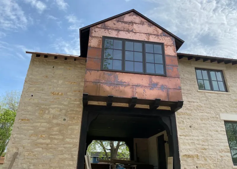 Copper metal panel facade on a stone building for Metal Roof Coating in Austintown